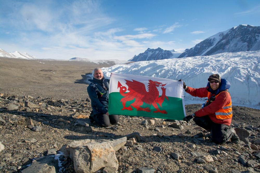 Myself and friend with Welsh flag at the Canada Glacier, Taylor Valley, McMurdo Dry Valleys