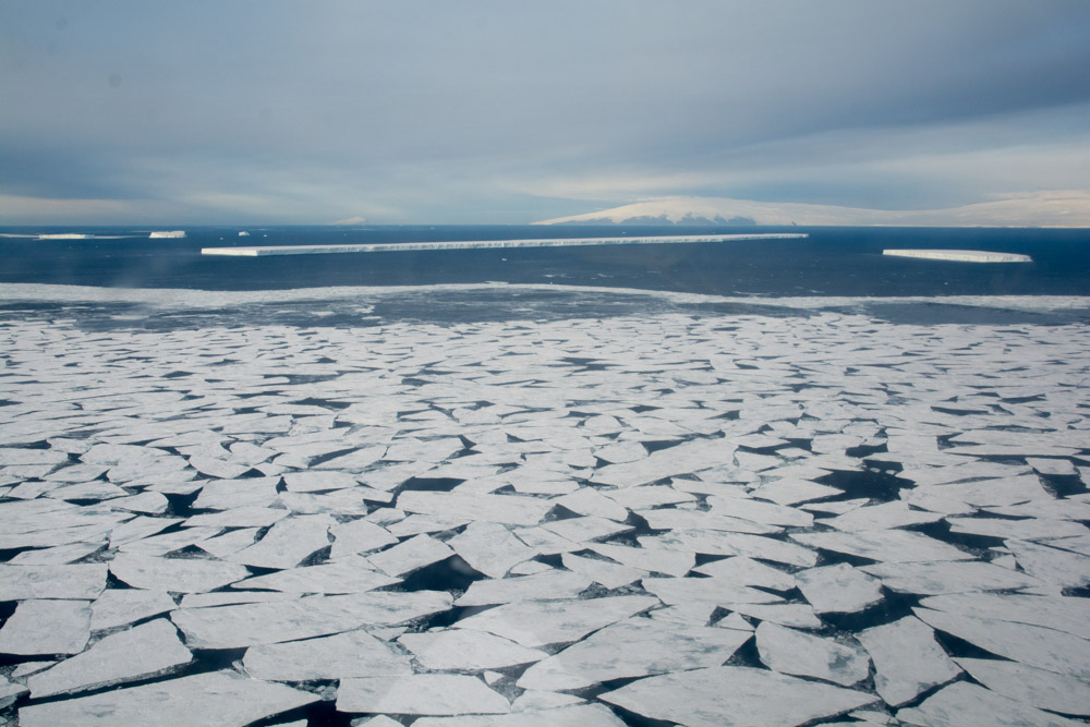 McMurdo Sound, with sea ice in the foreground and a 4 km long iceberg in the background
