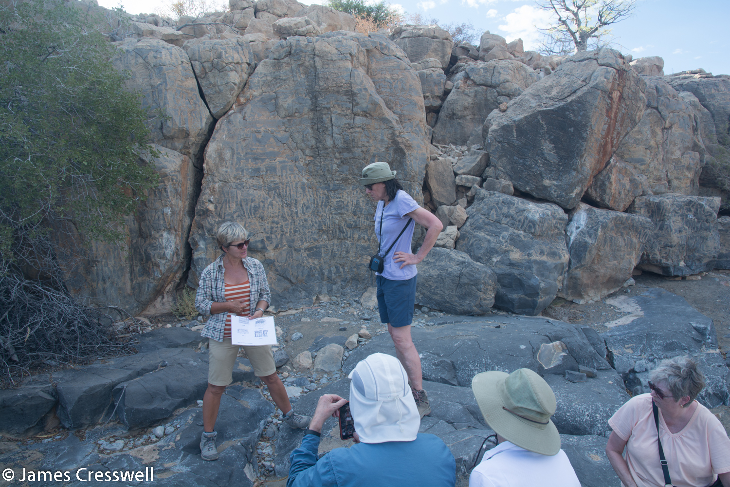Nicole explaining the story of the stromatolites and Namacalathas fossils to the group