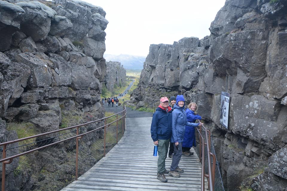 People on bridge in rock fracture