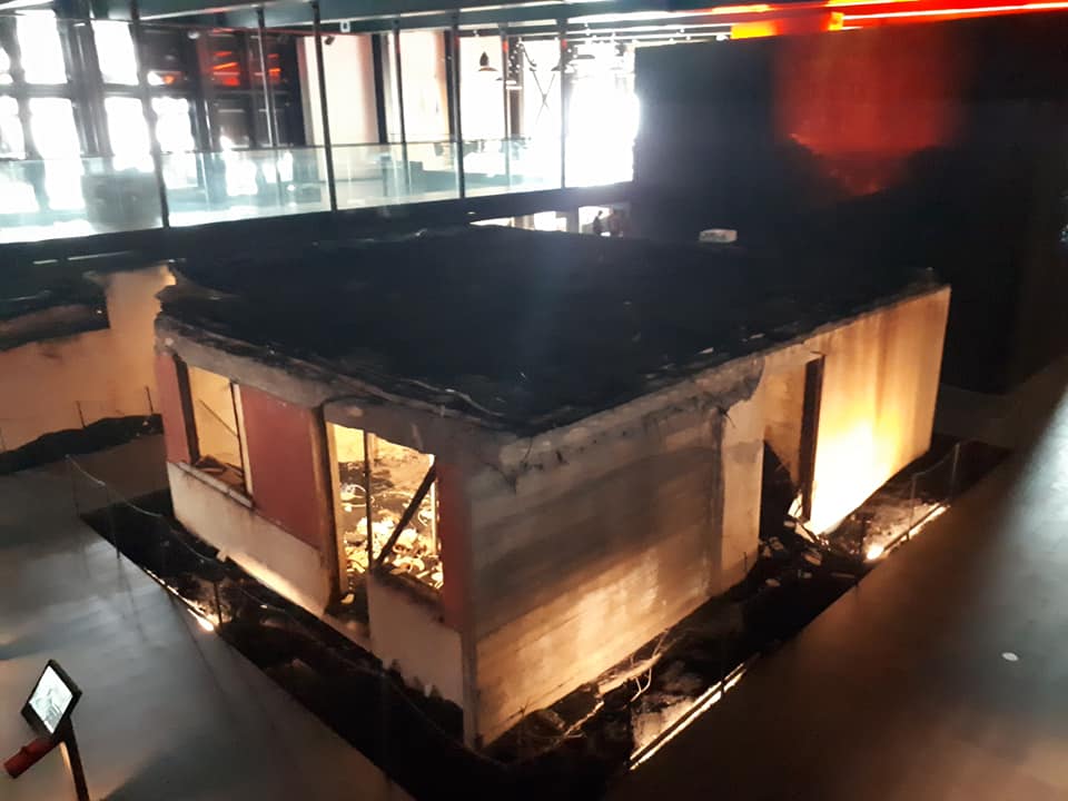 Excavated house within a museum