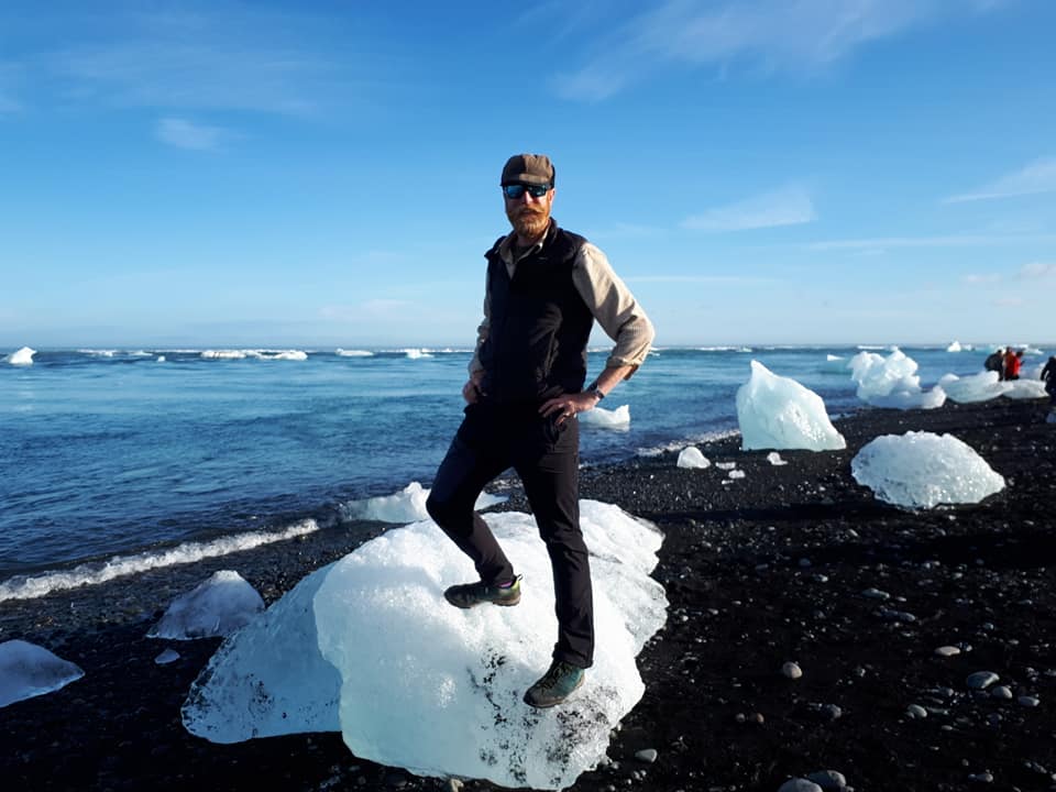 Man standing on small iceberg
