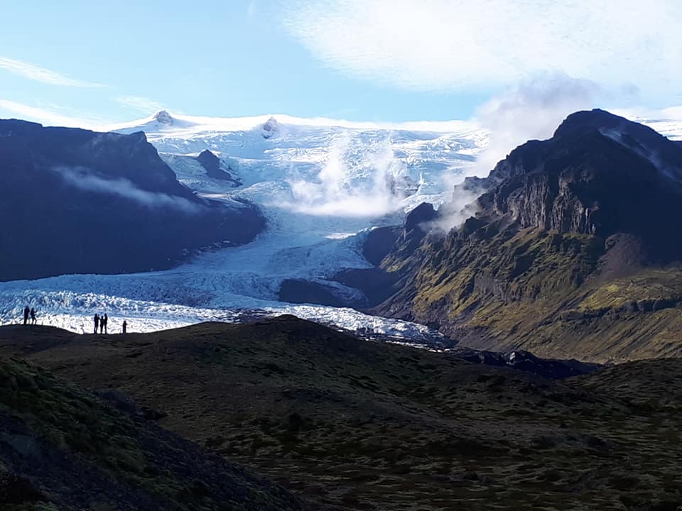 View of glacier flowing off a mountain