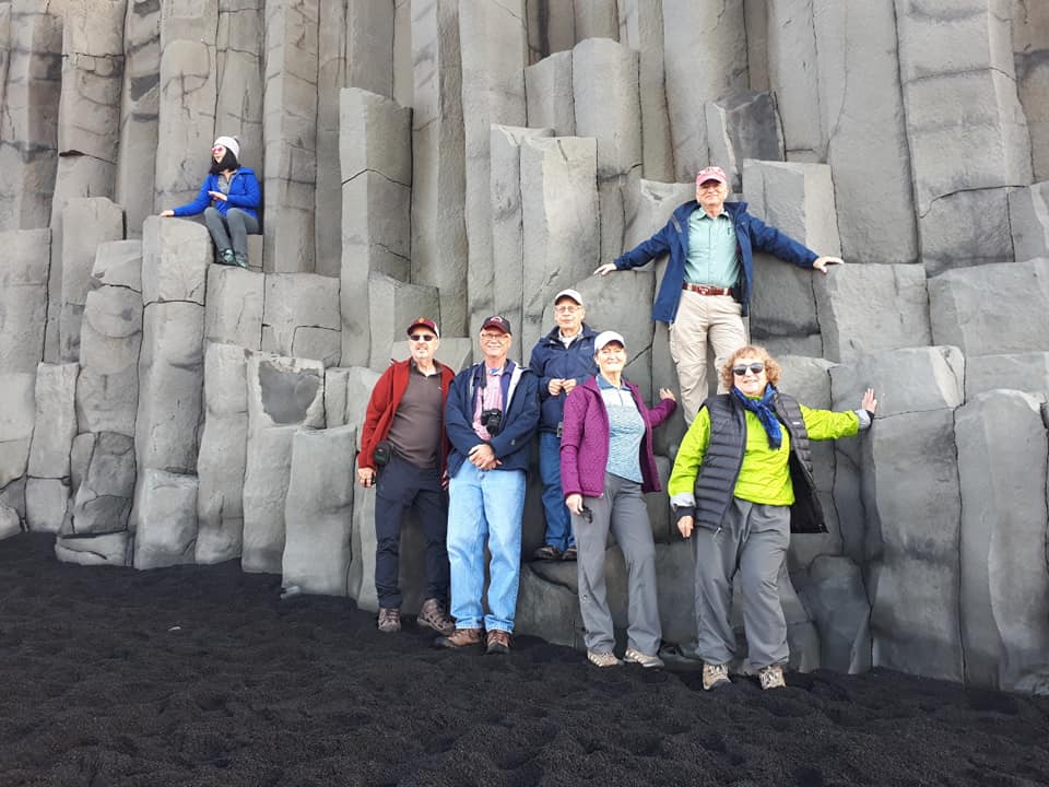 People in front of columnar basalt