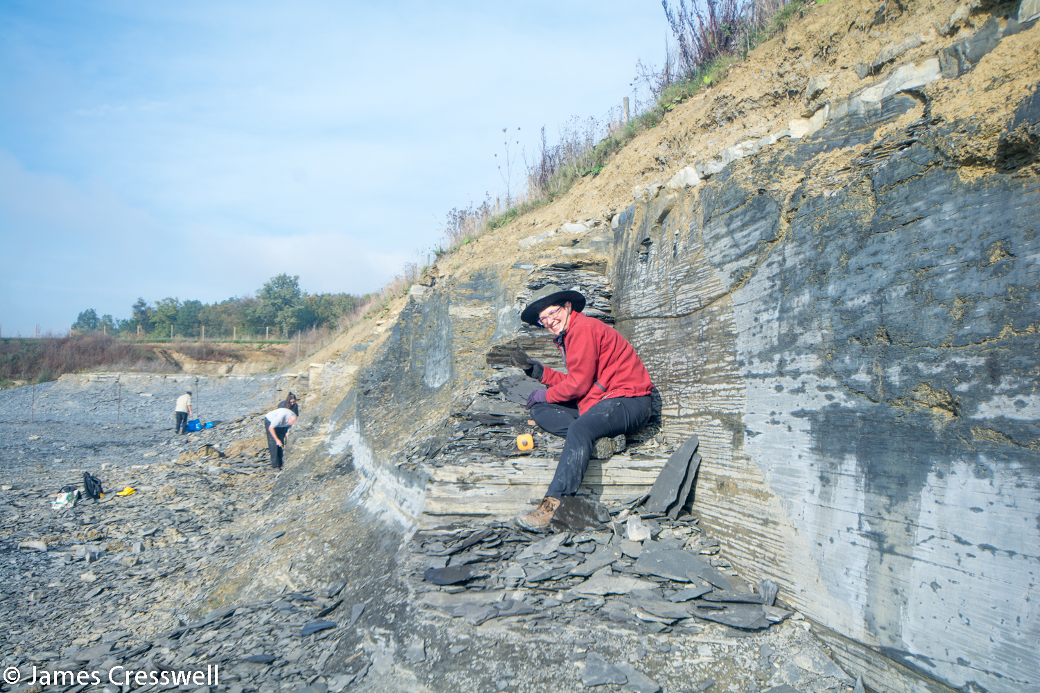 Lady finding fossils in quarry