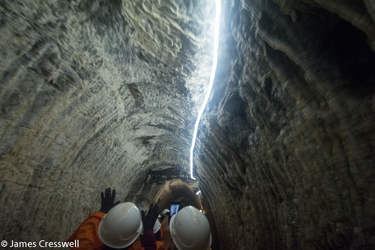 People in underground mine tunnel