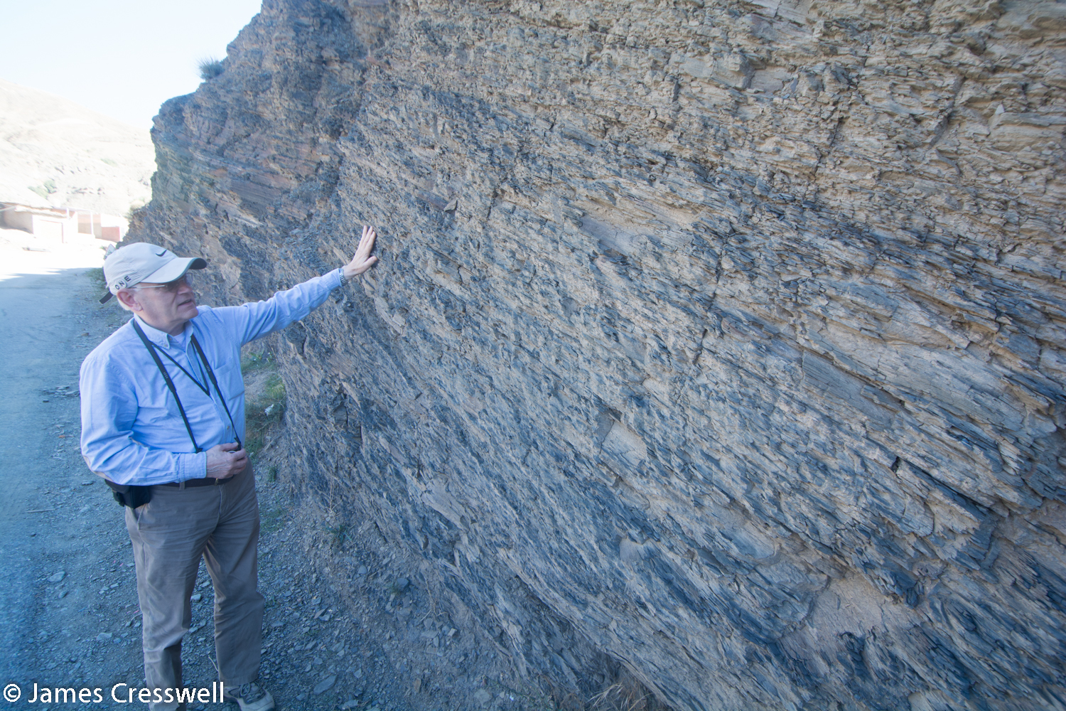 Man looking at Cambrian marine sediments
