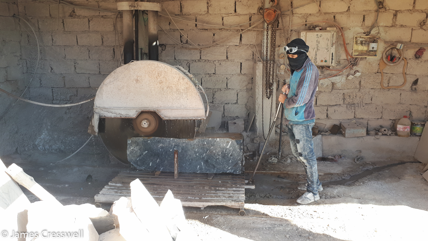 Man working by a cutting machine