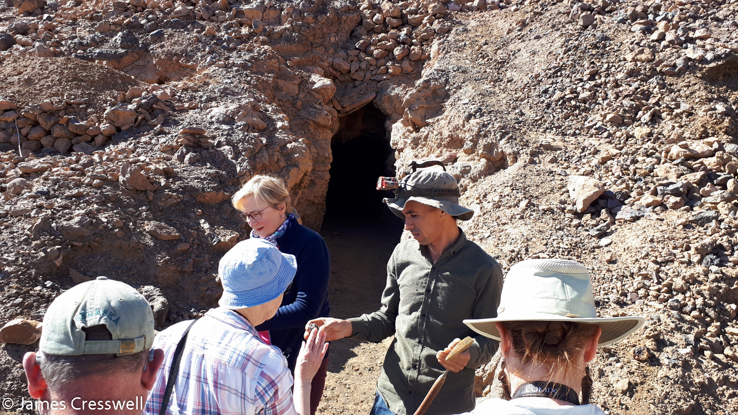 People outside a mineral mine