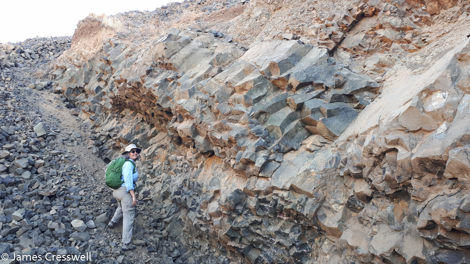 Woman next to columnar cooling structures
