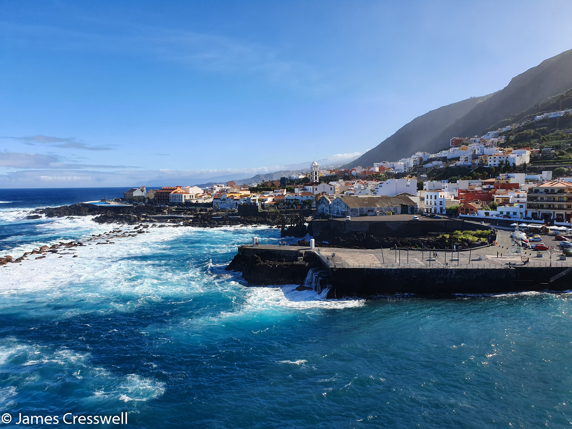 Town by the sea with waves coming in