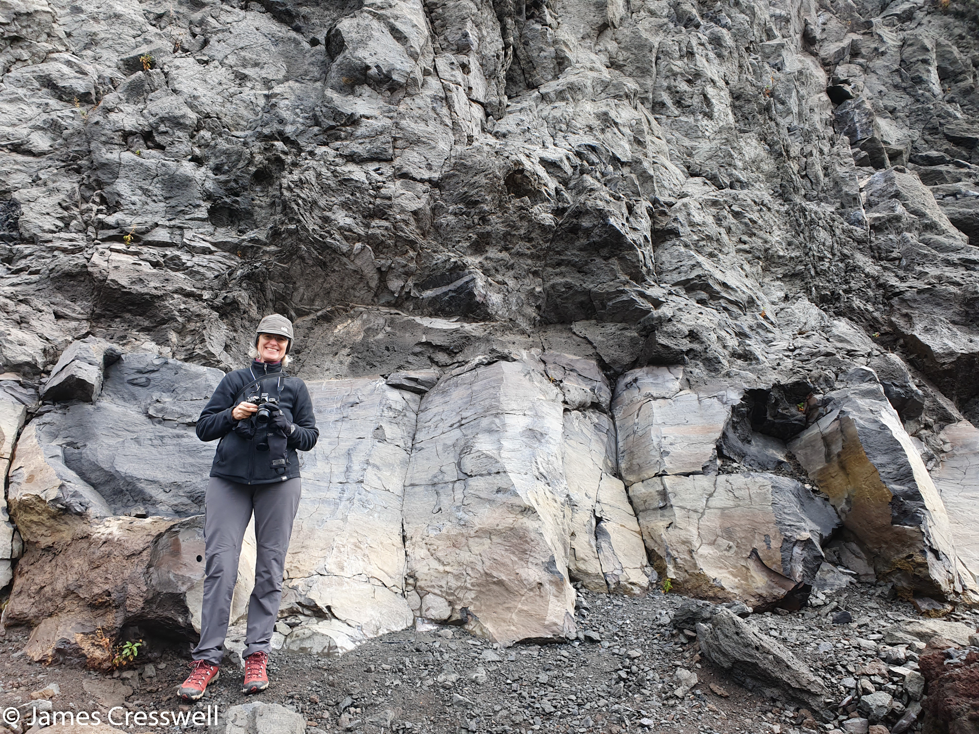 Woman standing in front of rock formations