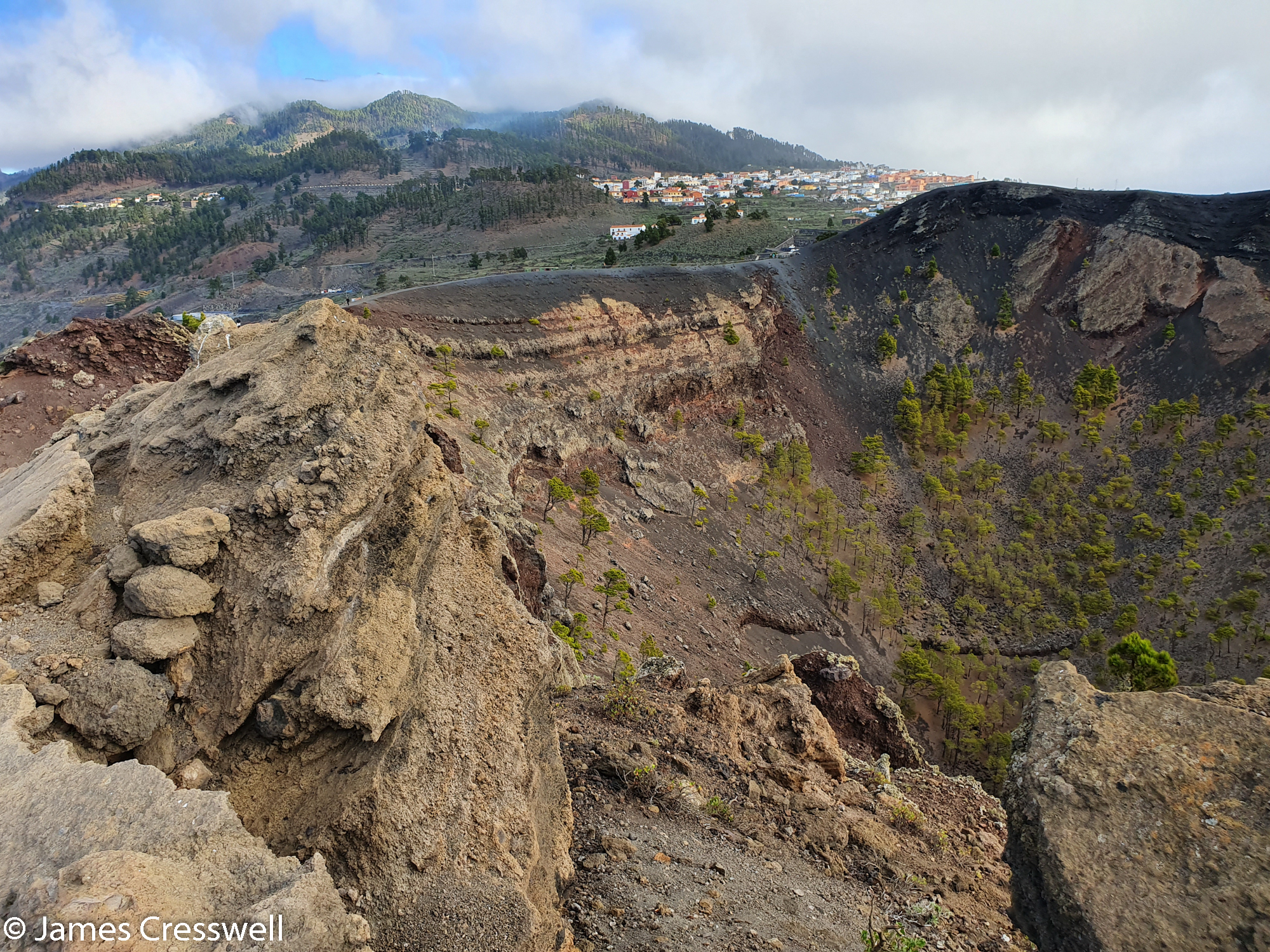 Volcanic crater with town in background