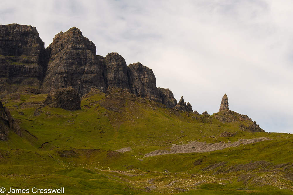 A cliff with a rocky pinnacle of the end
