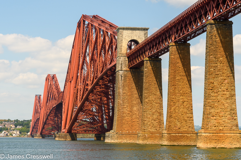 A large red metal bridge