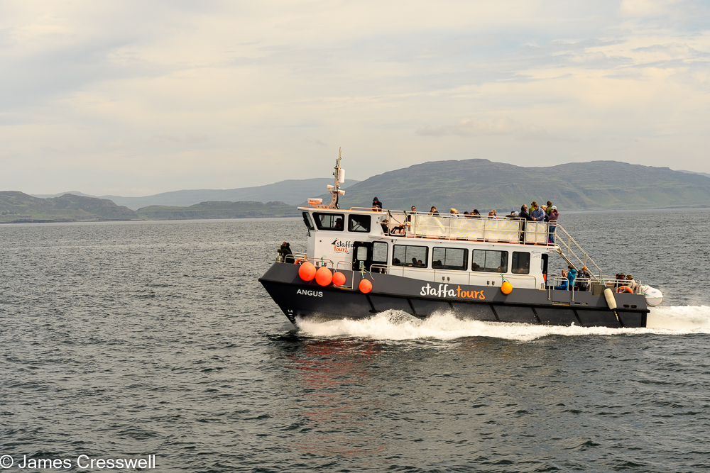 A boat moves from right to left
