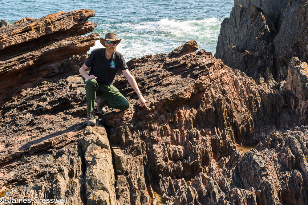James Cresswell points to Hutton's Unconformity at Siccar Point