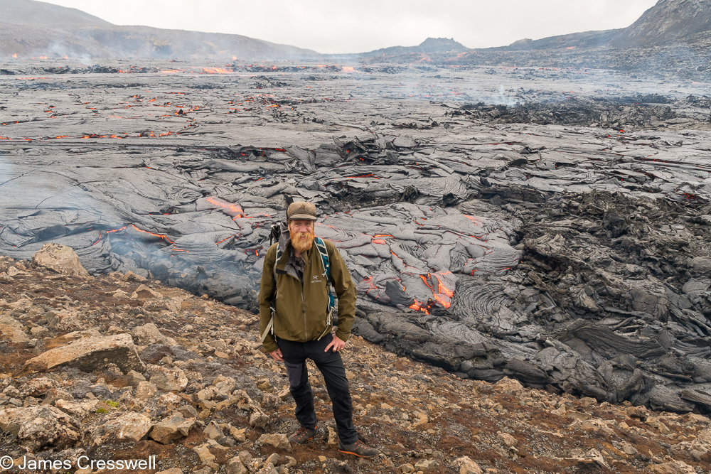 Man standing next to lava