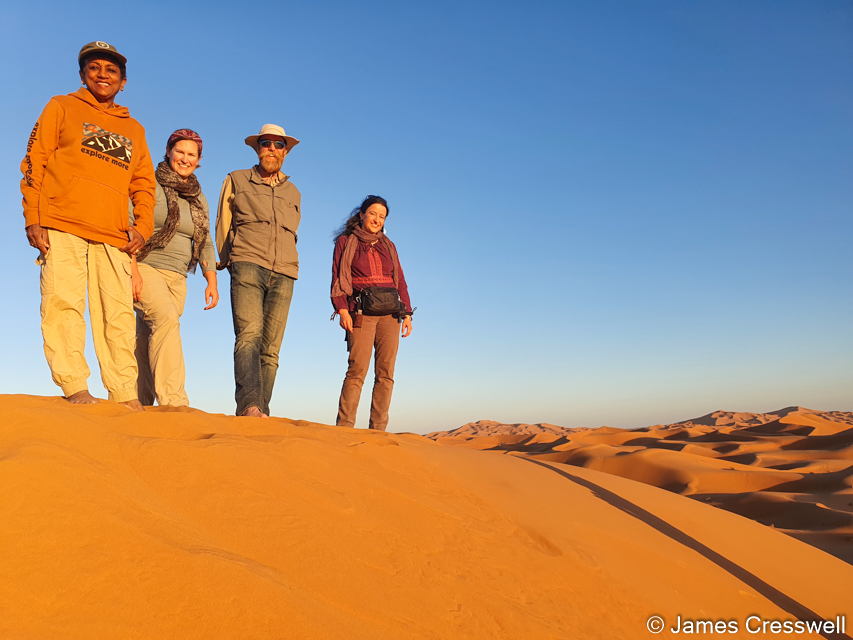 Sita, Caitlin, James and Sophie in the Erg Chebbi dunes to watch the sunset as part of our camel ride
