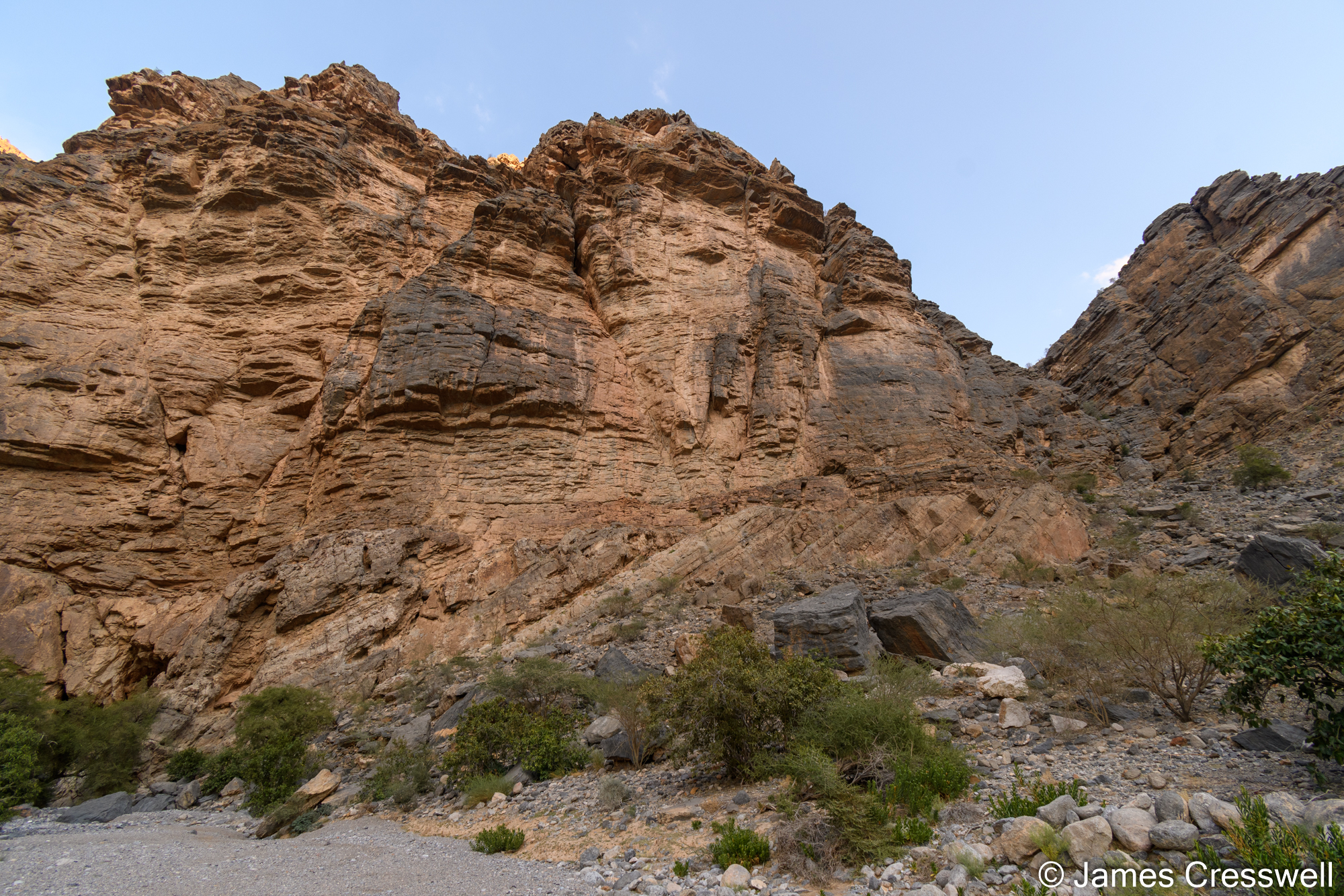 An angular unconformity with tilted Ediacarian aged rocks beneath Permian rocks.