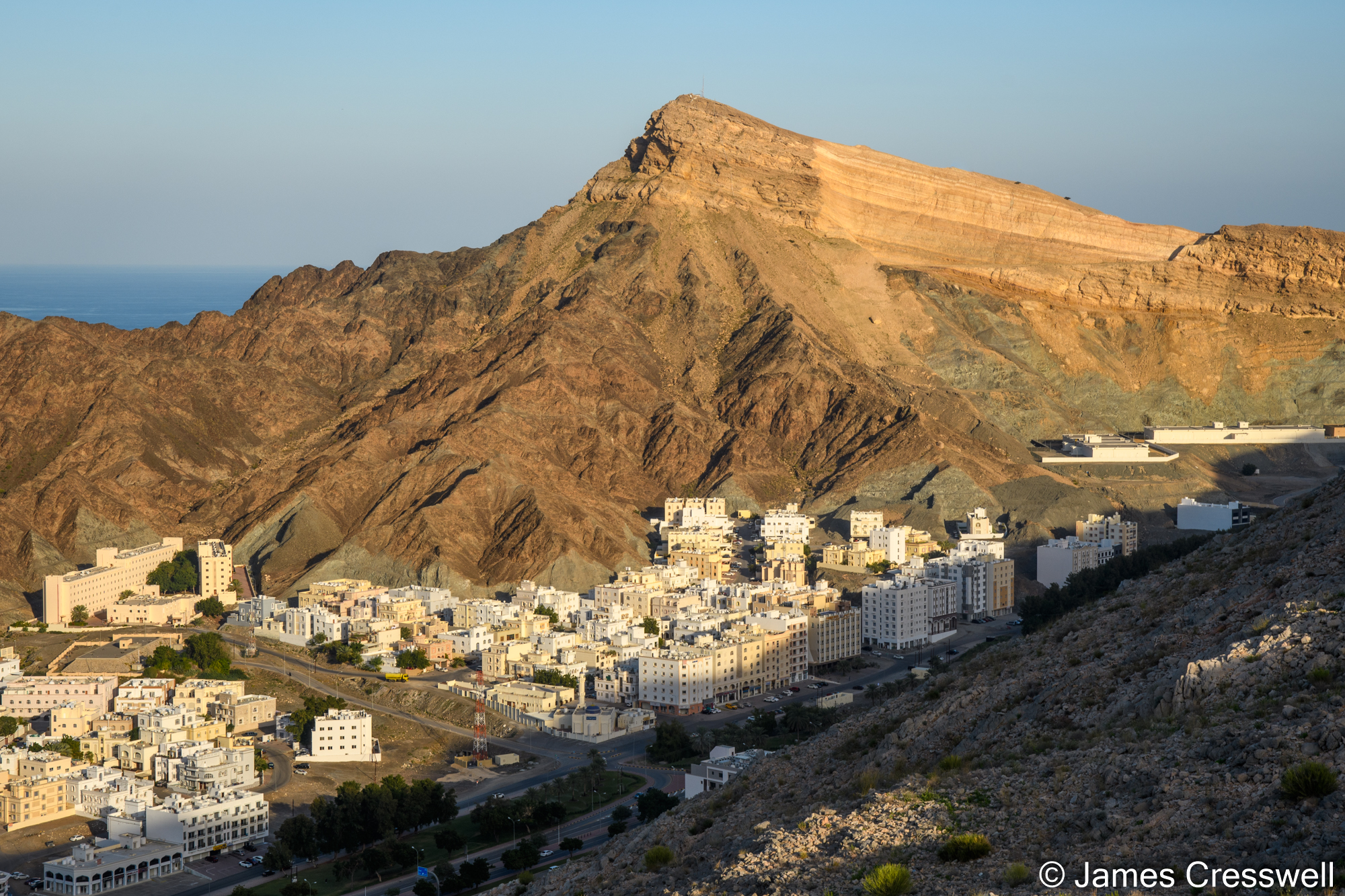 View of buildings in front of a mountain