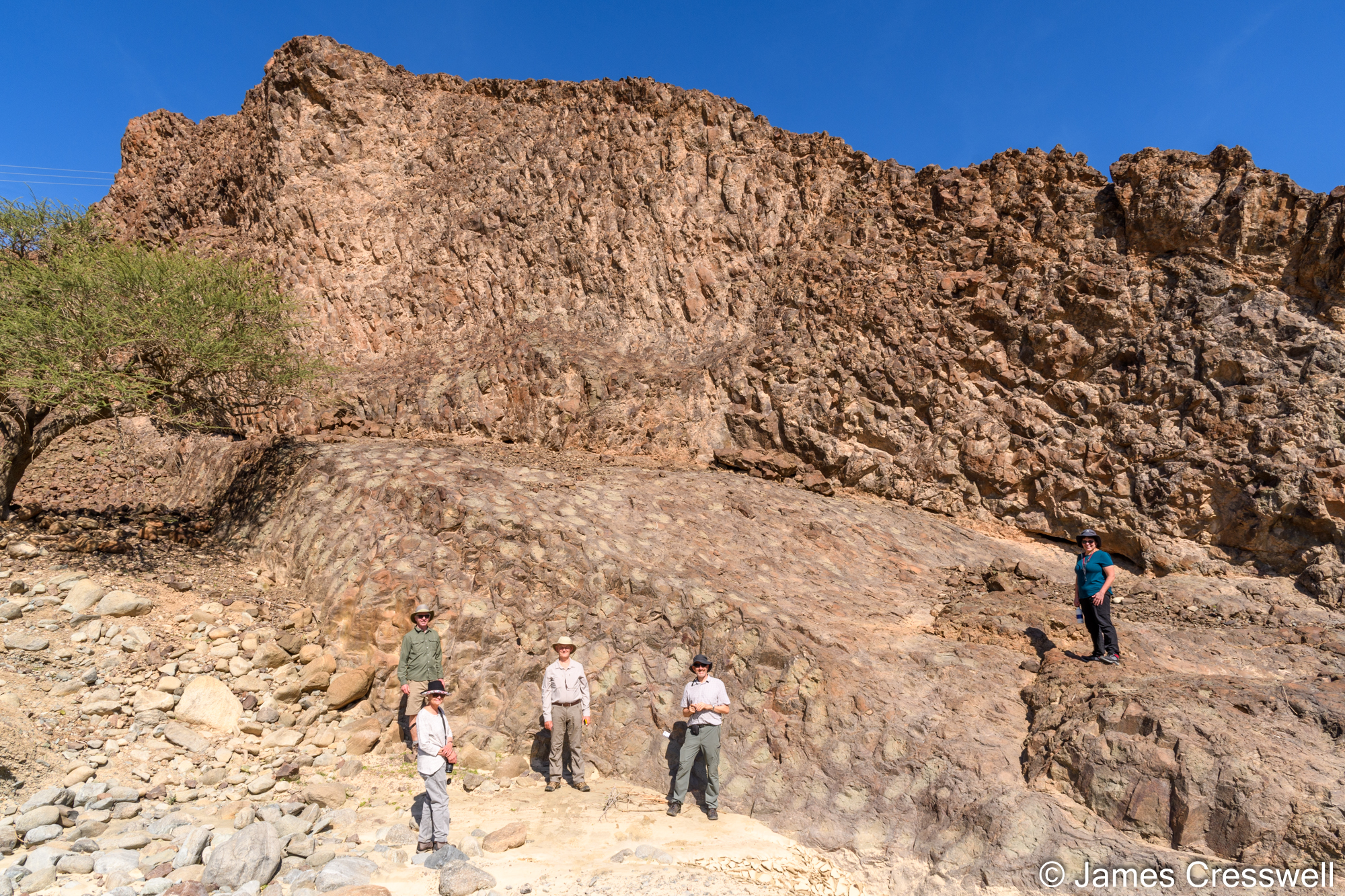 People standing by some rocks