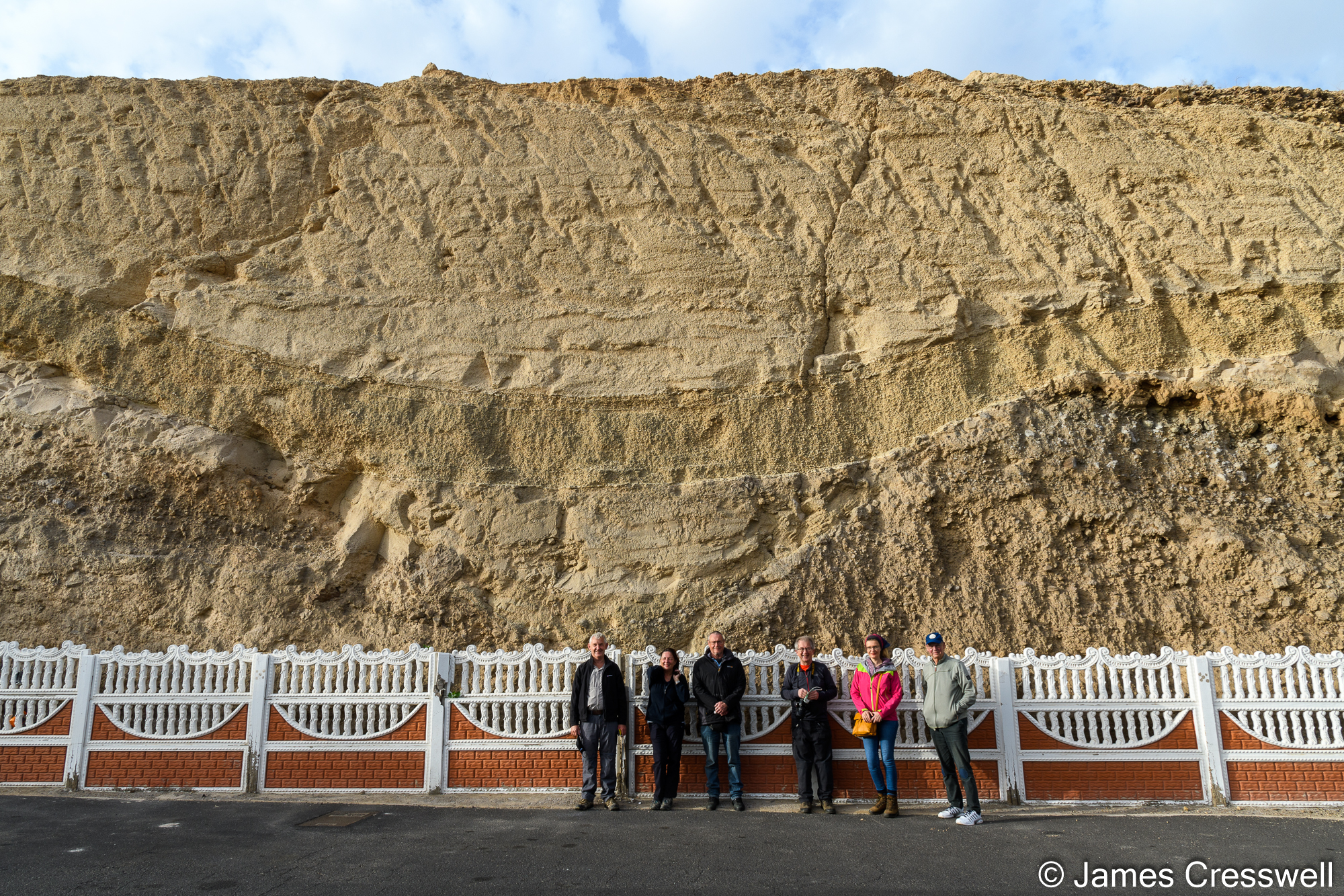 The group in front of a channel filled with pyroclastic flow material from a trachyte eruption of Mna Guaza 926,000 years ago.