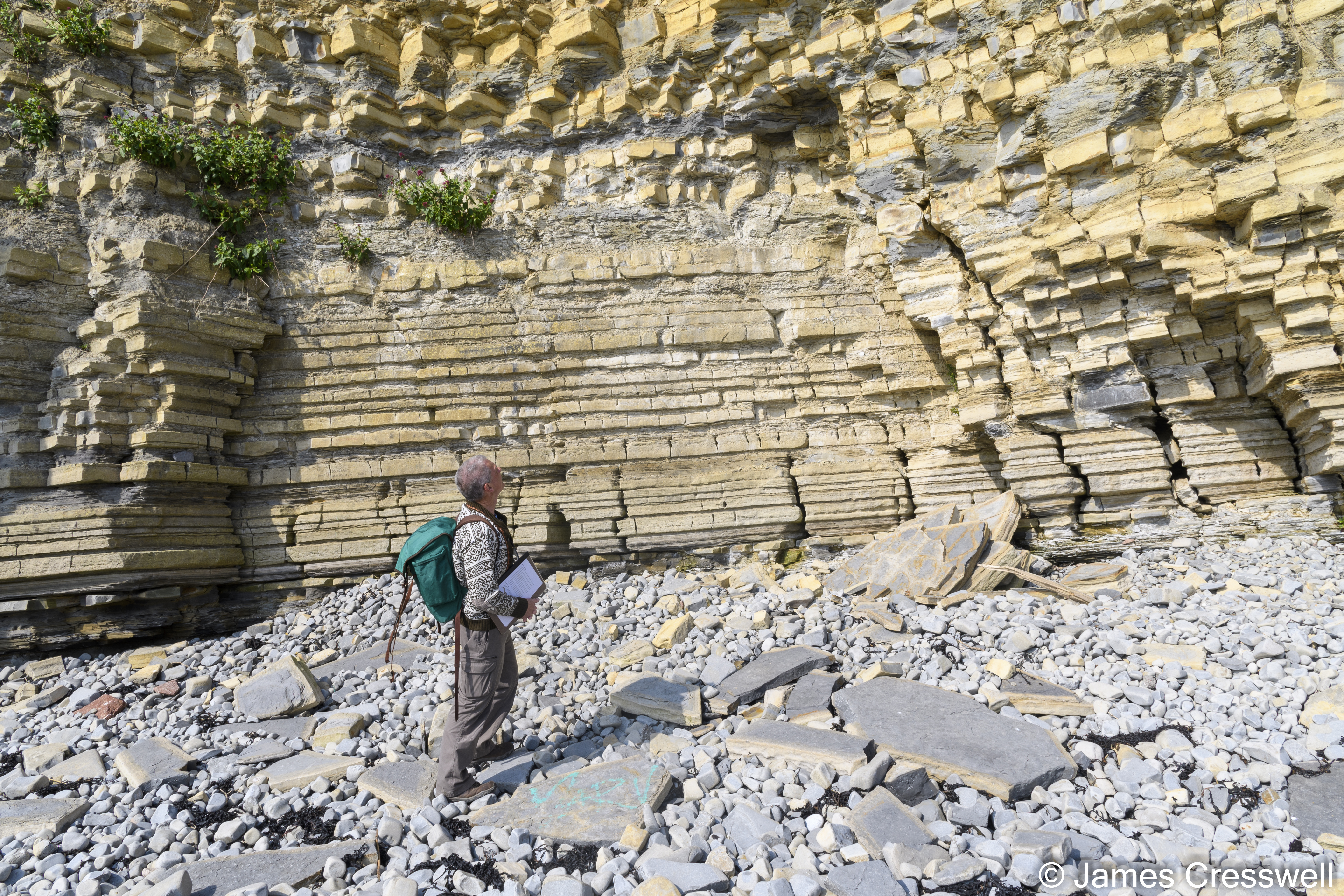 Man standing by a cliff