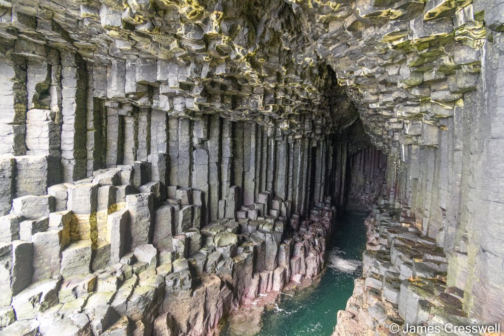 Inside a cave with hexagonal cooling columns