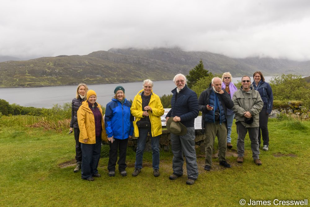 Group of people in front of a lake