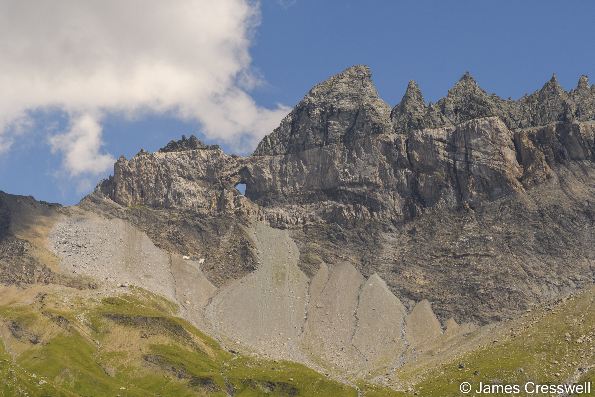 View of a mountain with a hole in the rock