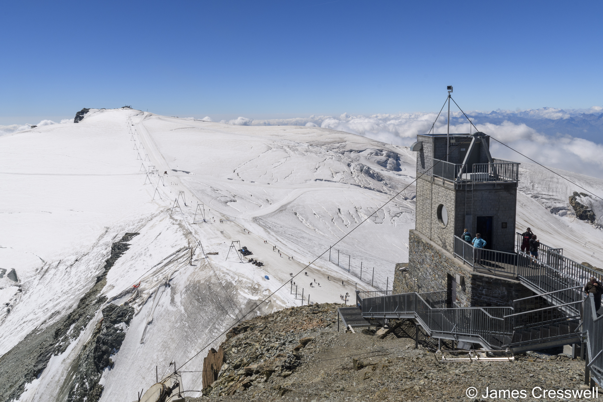 Mountain viewing platform with snow in the background