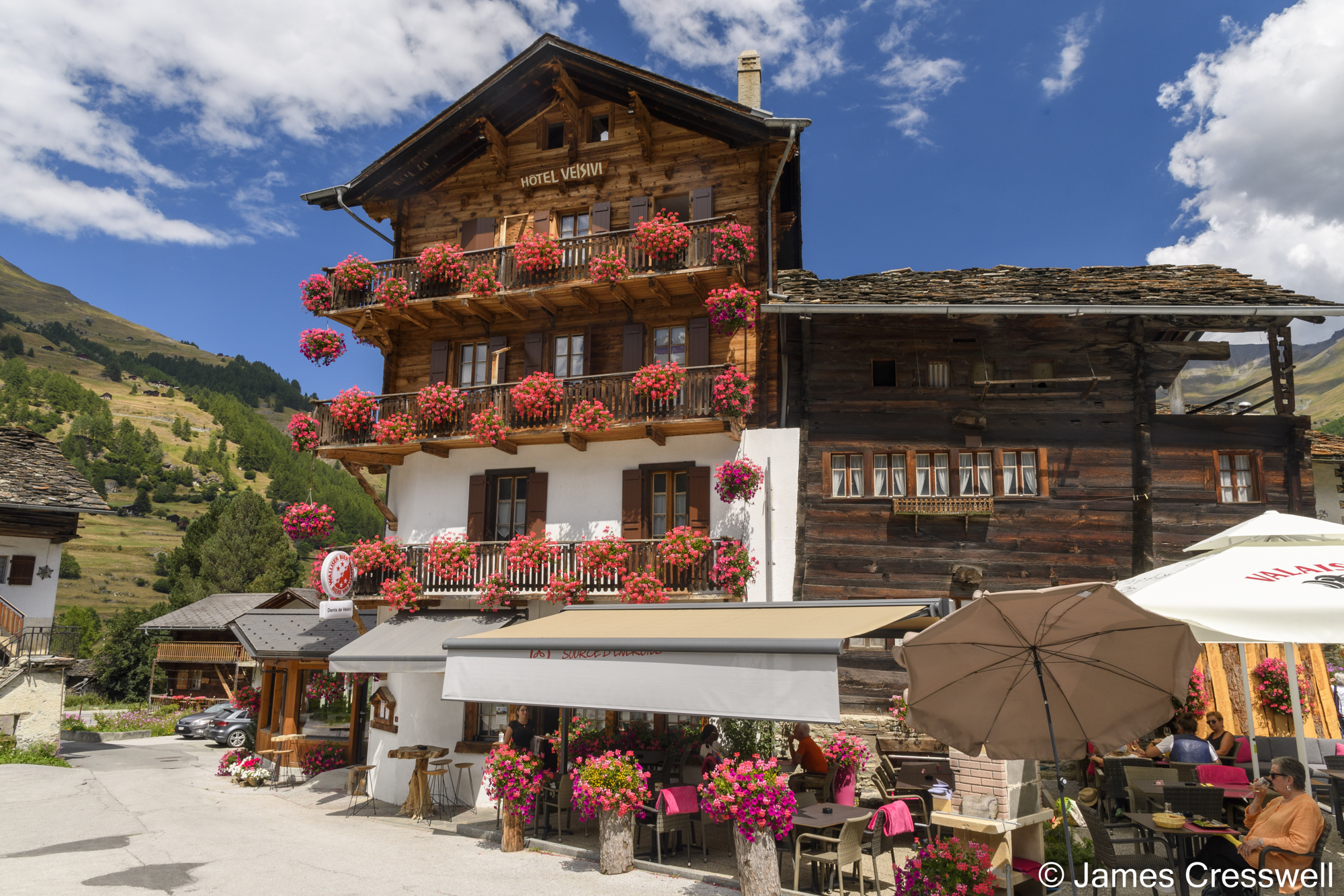 A wooden chalet with flowers