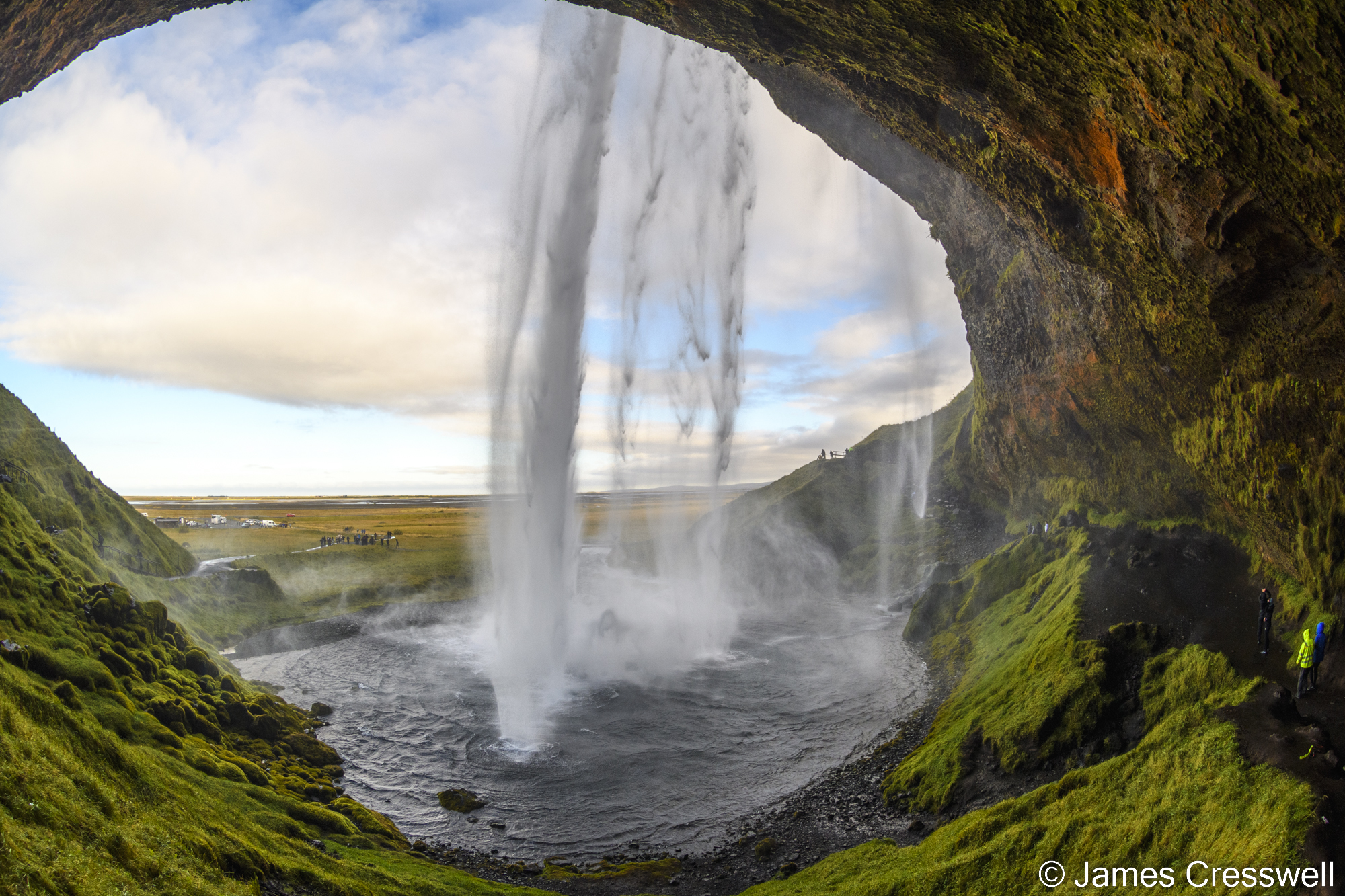 Looking out of a cave with a waterfall in front