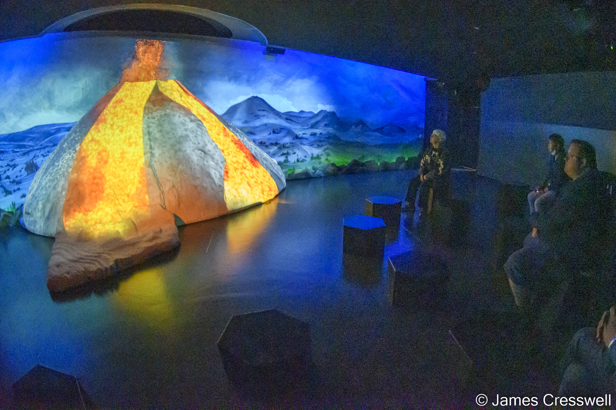 People watching a display in a museum