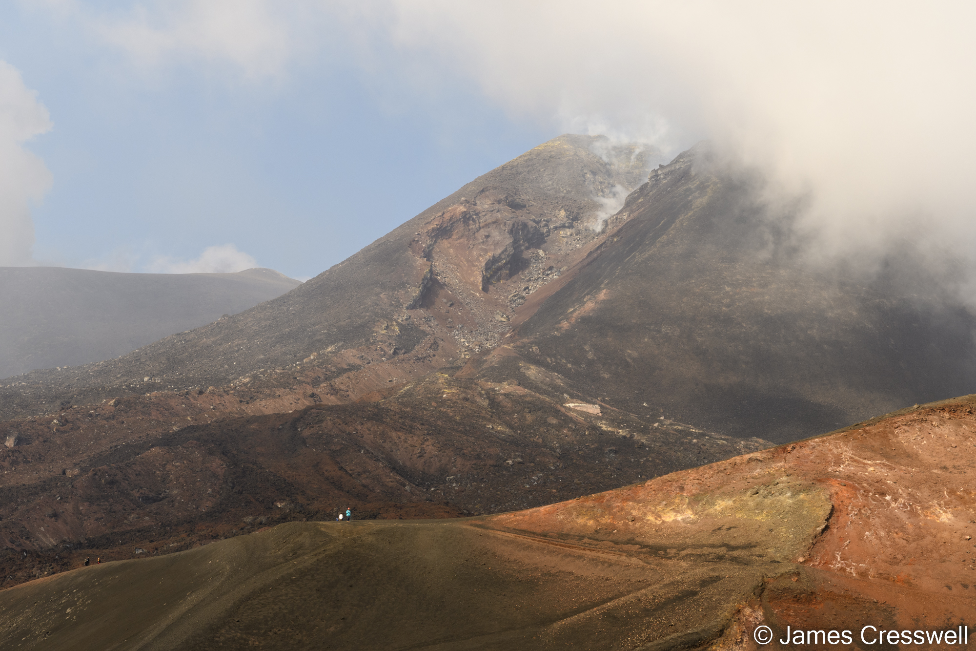 View of a volcano partly in the cloud
