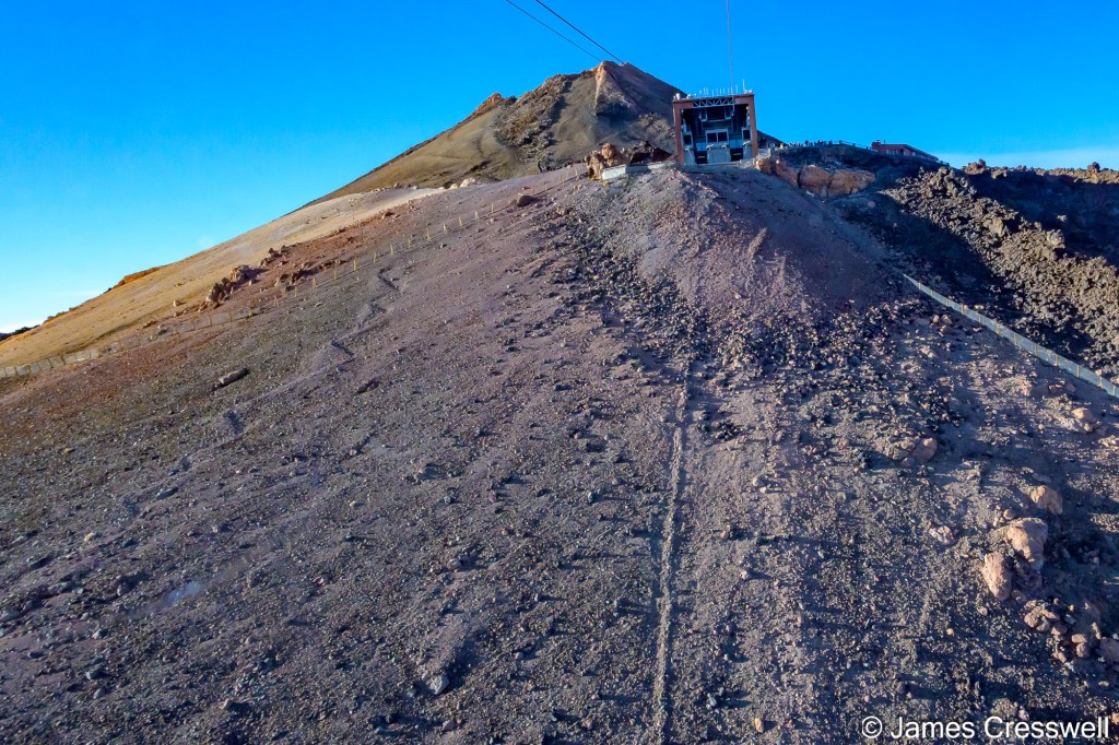 A view of the summit of Mt Teide and the Upper Cable Car Station from inside the cable car on our descent. 