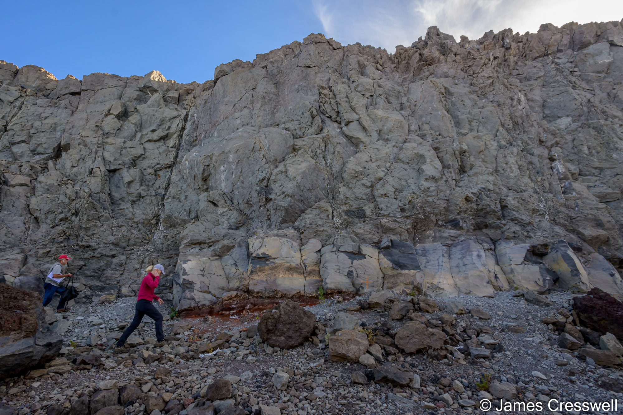 A photo of two different lava flows which have two different chemistries, sitting one on top of the other