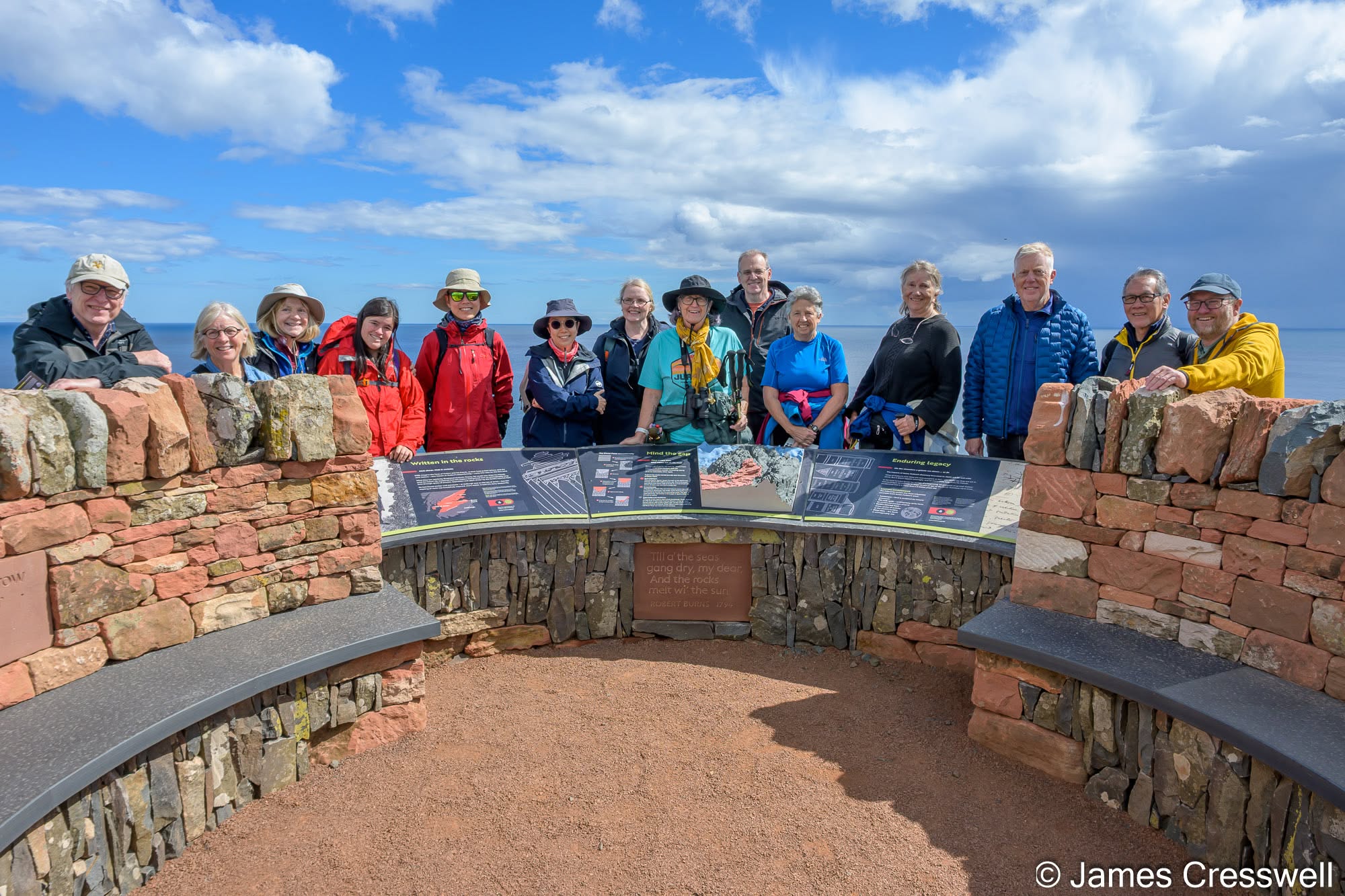 The GeoWorld Travel group with Angus Miller at the new Deep Time Trail viewpoint above Siccar Point.